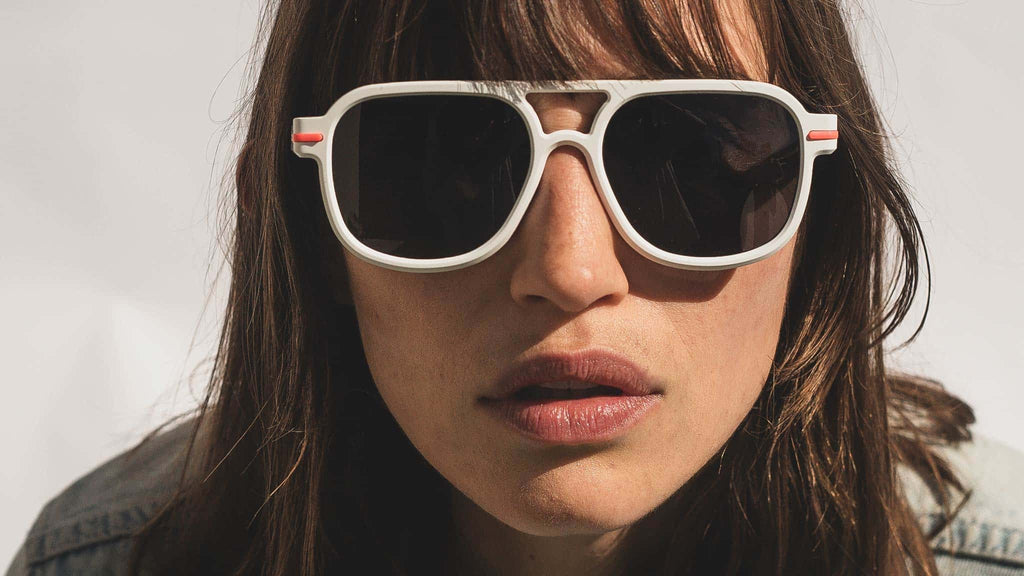 woman wearing white aviator sunglasses