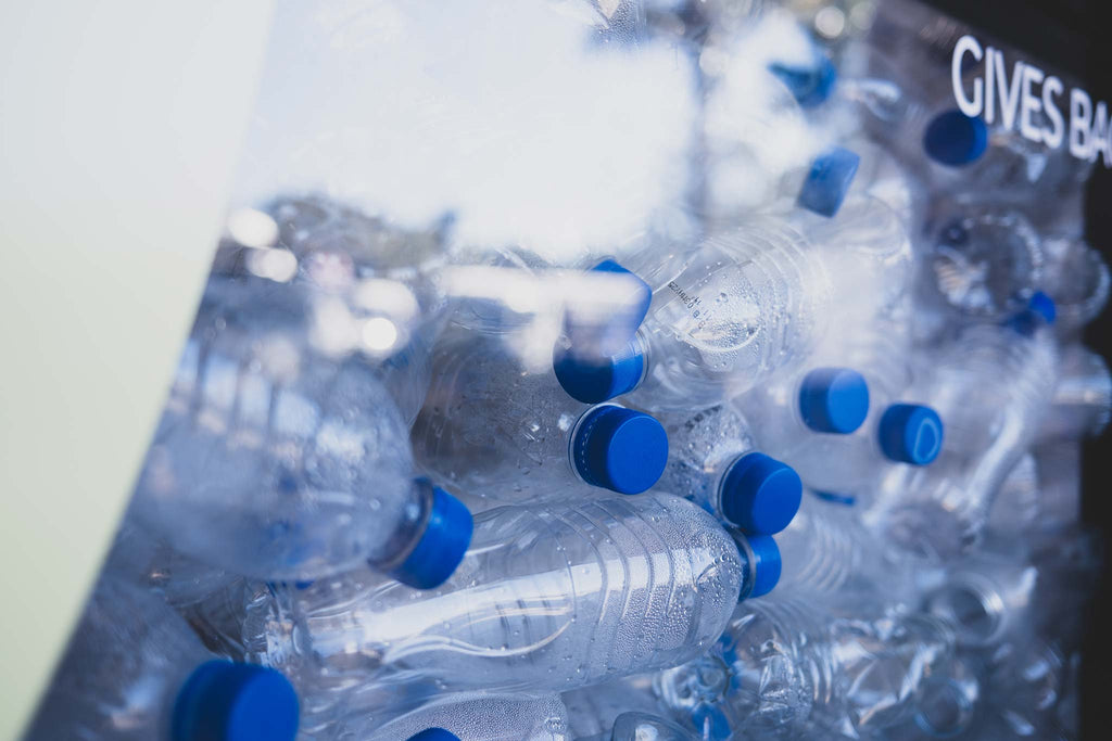 empty plastic bottles squashed together in a shop window to highlight the waste issue