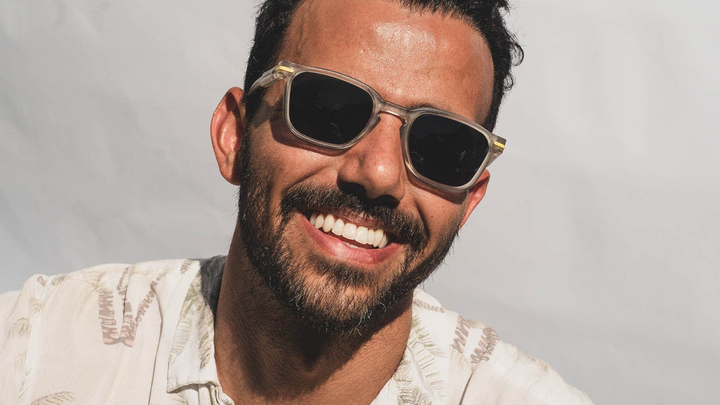 man wearing wayfarer sunglasses in the sun