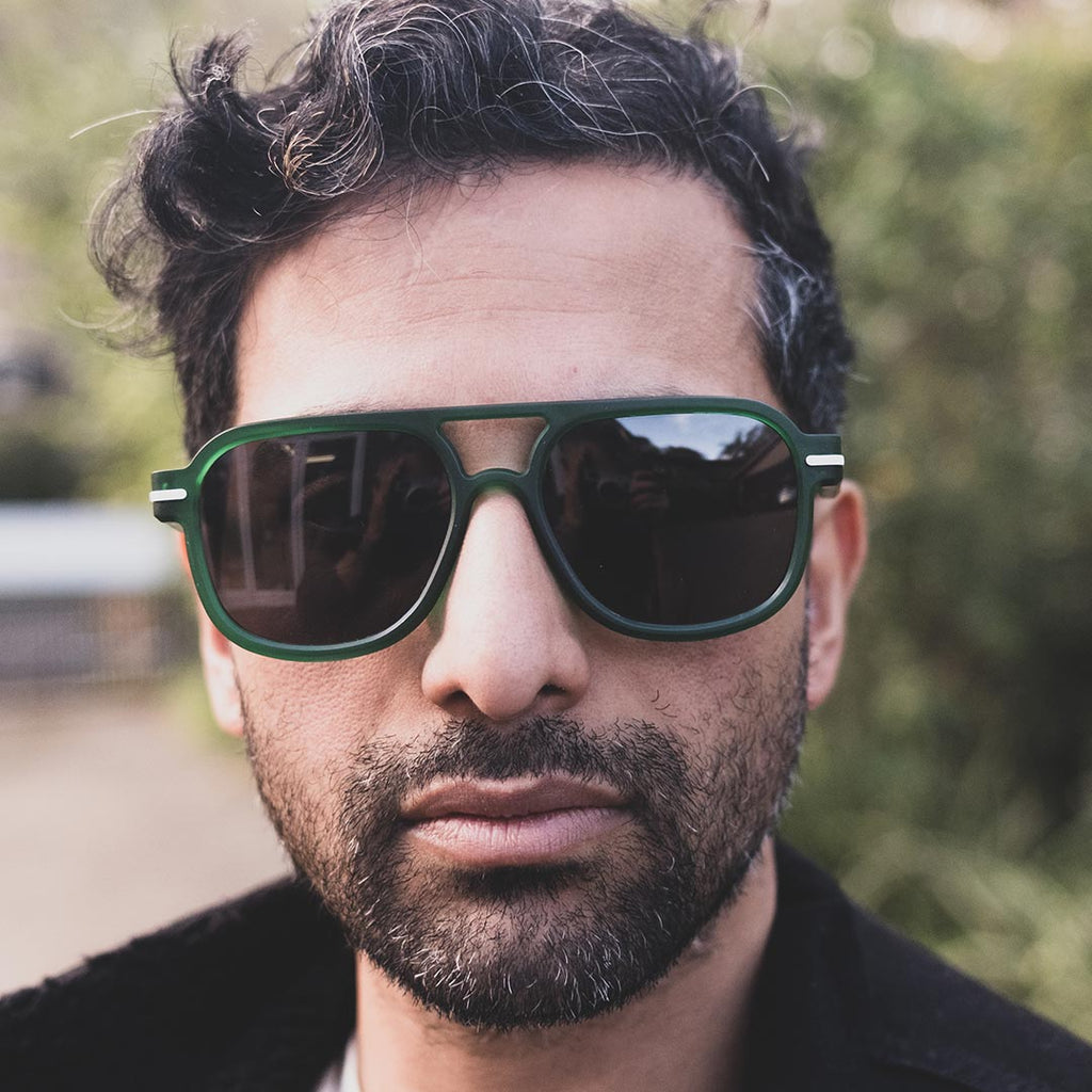 Man wearing Good Citizens aviator green glasses outside, showcasing stylish and eco-friendly eyewear made in Australia.