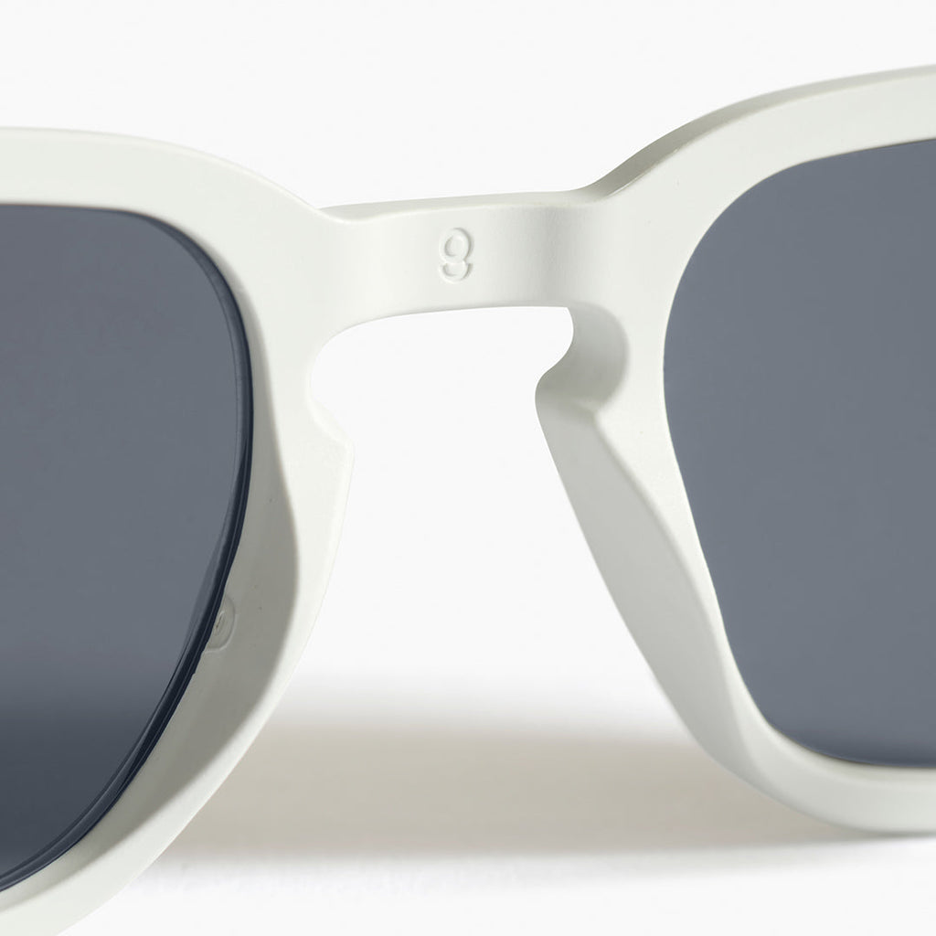 Back close-up detail of white square sunglasses made in Australia, showing the 100% recycled frame and award-winning detail