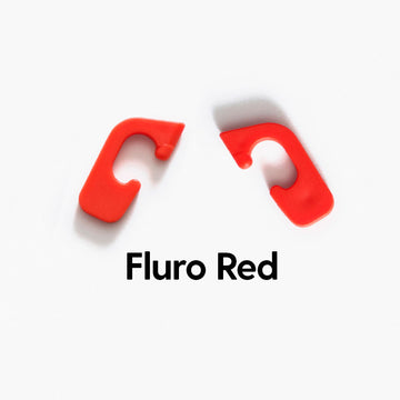 Fluro red interchangeable clips for Good Citizens' 100% recycled frames, adding vibrant, customisable style