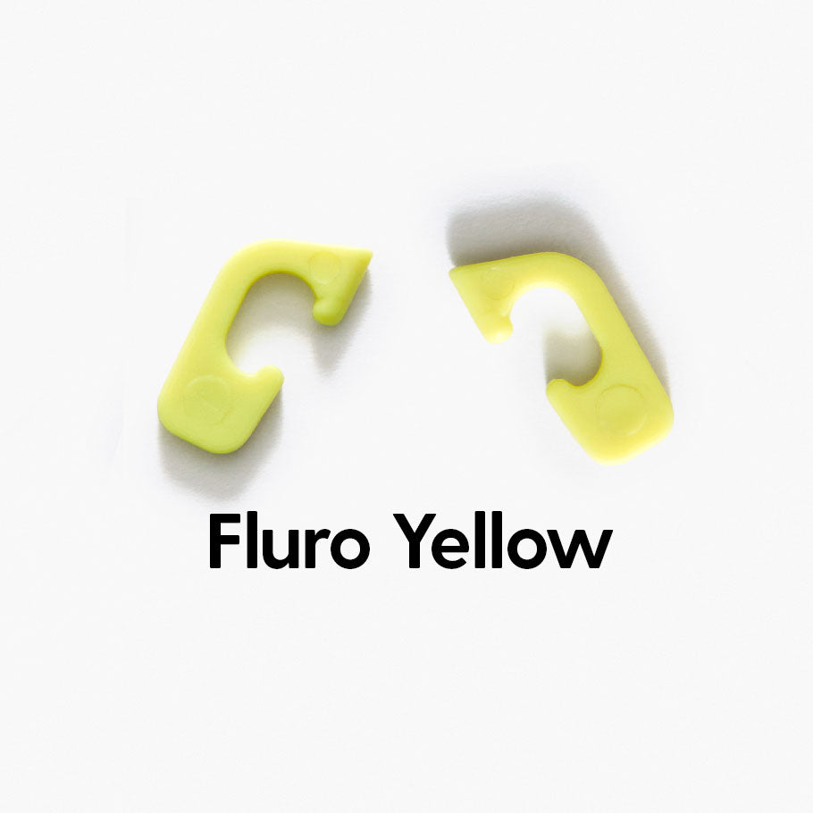 Fluro yellow interchangeable clips for Good Citizens' 100% recycled frames, adding vibrant, customisable style